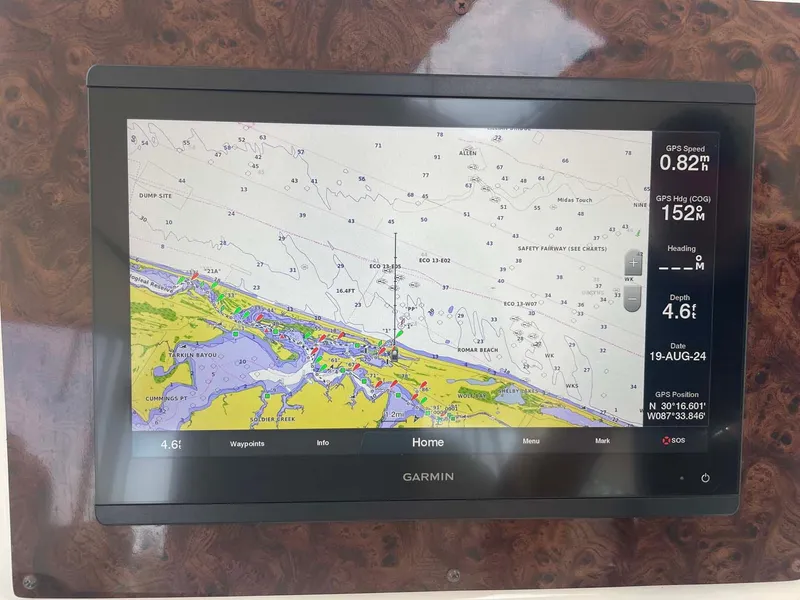 Slide: The Image of Garmin navigation display on 2003 Sea Ray 560 Sedan Bridge, showing nautical chart and GPS data. - 13