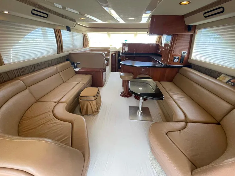 Slide: The Image of Luxurious interior of a 2003 Sea Ray 560 Sedan Bridge yacht with leather seating. - 21