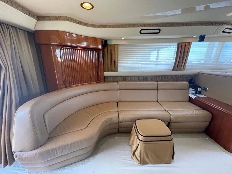 Slide: The Image of Luxurious interior of 2003 Sea Ray 560 Sedan Bridge yacht with beige leather seating. - 22