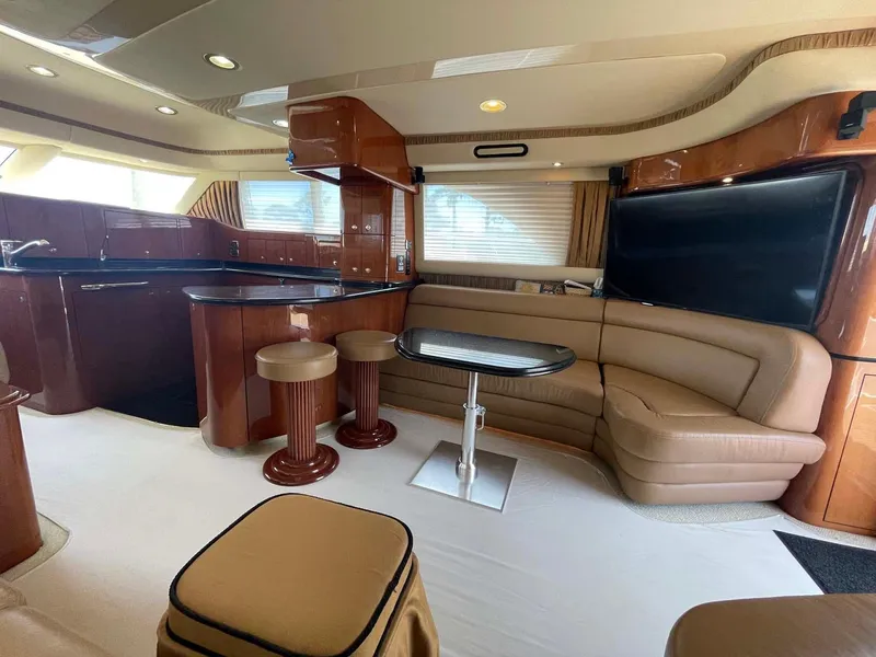Slide: The Image of Luxurious interior of a 2003 Sea Ray 560 Sedan Bridge yacht with elegant seating and modern design. - 24