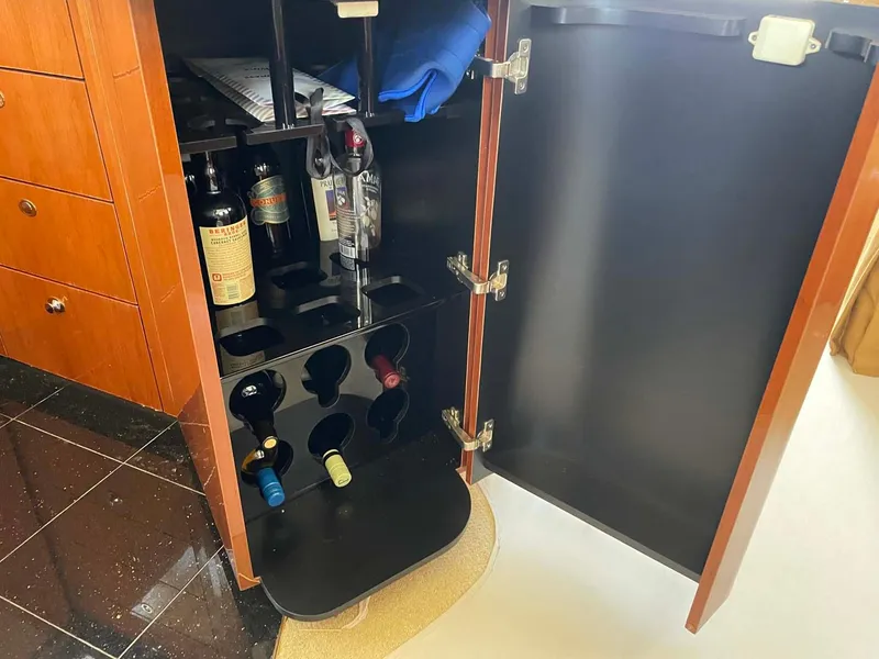 Slide: The Image of Wine storage cabinet on a 2003 Sea Ray 560 Sedan Bridge yacht. - 26