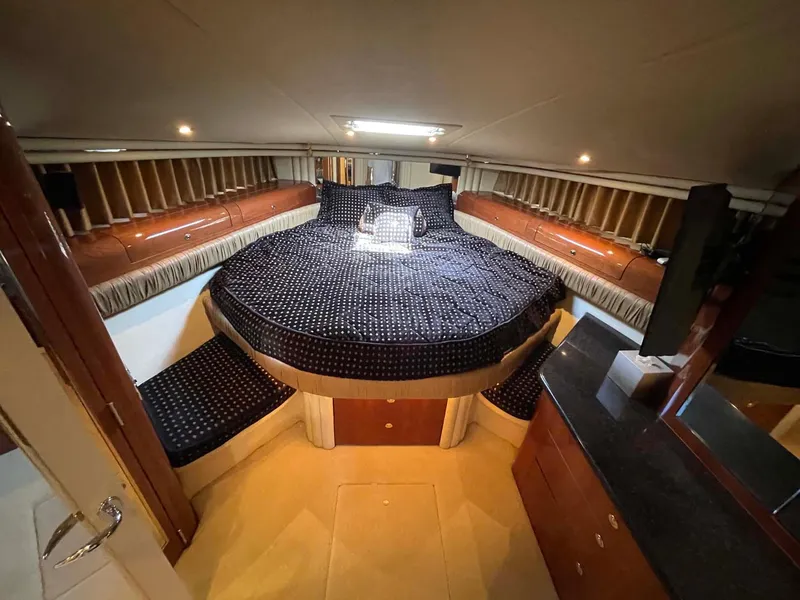 Slide: The Image of Luxurious bedroom interior of 2003 Sea Ray 560 Sedan Bridge yacht. - 34