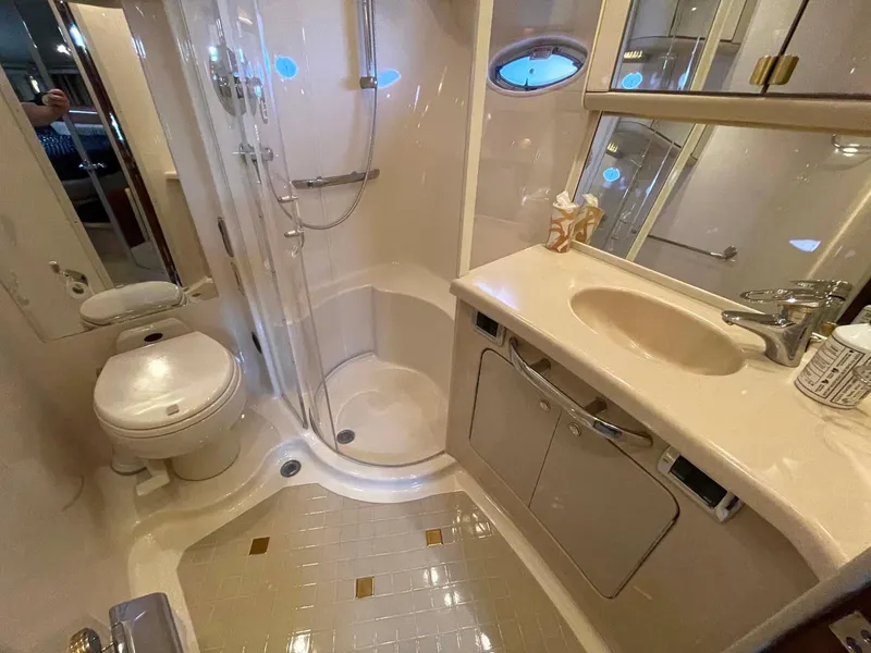 Slide: The Image of Luxurious bathroom in 2003 Sea Ray 560 Sedan Bridge yacht with shower and vanity. - 37
