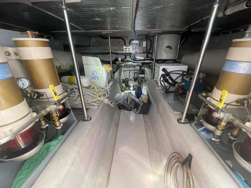 Slide: The Image of Engine room of a 2003 Sea Ray 560 Sedan Bridge, showcasing mechanical components and equipment. - 39