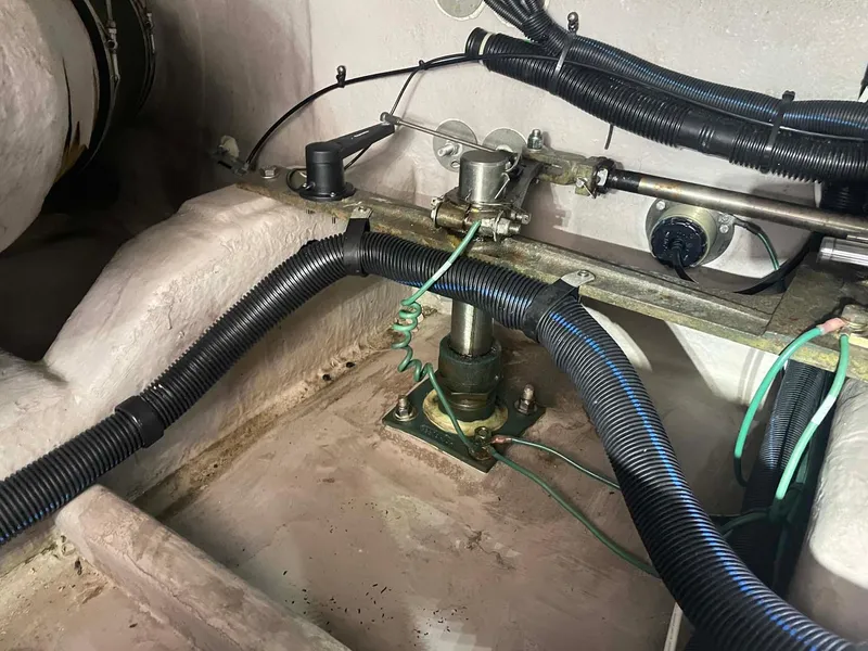 Slide: The Image of Engine compartment of a 2003 Sea Ray 560 Sedan Bridge with visible wiring and components. - 40