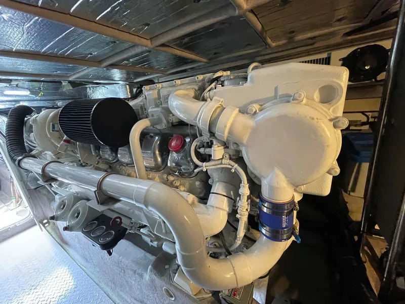 Slide: The Image of Engine of 2003 Sea Ray 560 Sedan Bridge yacht, showcasing intricate mechanical components. - 47