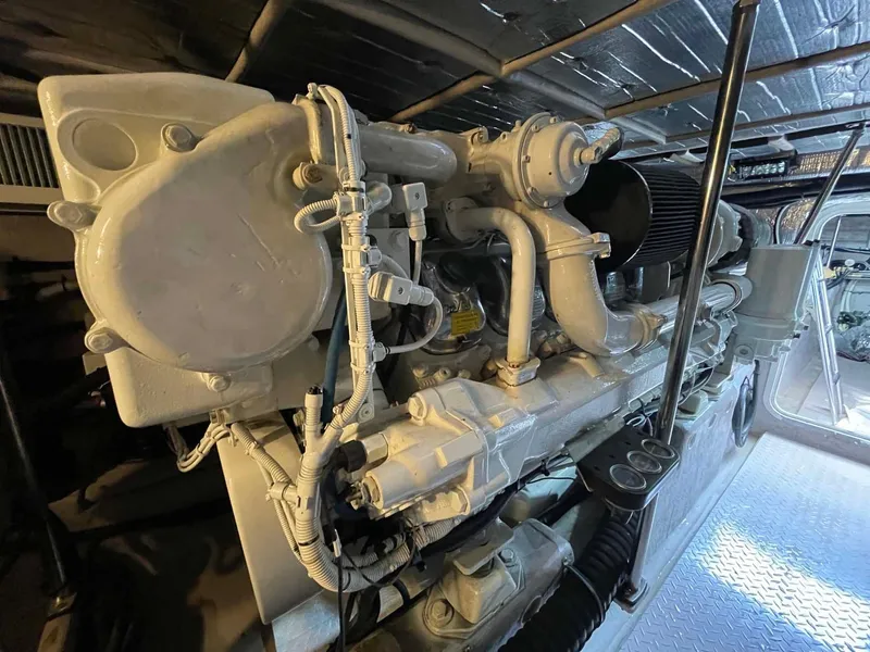 Slide: The Image of Engine room of 2003 Sea Ray 560 Sedan Bridge yacht, showcasing detailed machinery. - 48