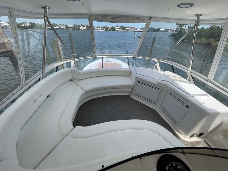 Slide: The Image of 2003 Sea Ray 560 Sedan Bridge interior with panoramic water view. - 9