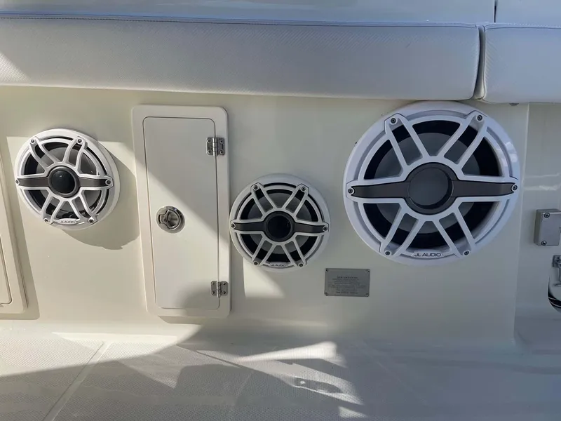 Slide: The Image of 2015 Hydra-Sports 3400 Center Console boat speakers and storage compartment. - 16