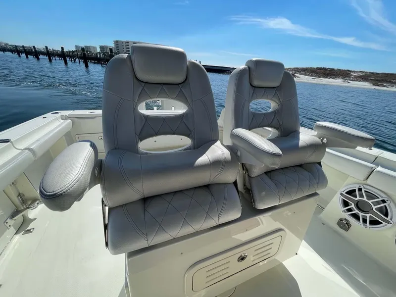 Slide: The Image of 2015 Hydra-Sports 3400 Center Console boat seats with ocean view in background. - 19