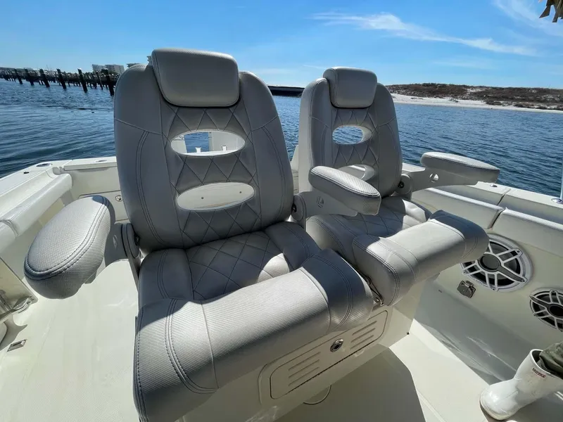 Slide: The Image of 2015 Hydra-Sports 3400 Center Console boat with luxurious seating on a sunny day. - 20