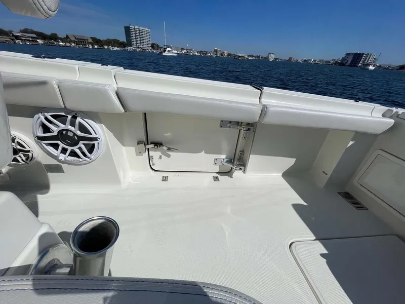 Slide: The Image of 2015 Hydra-Sports 3400 Center Console boat interior with speakers, overlooking a waterfront cityscape. - 21