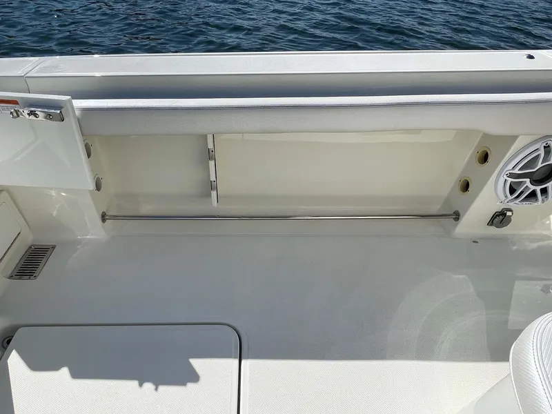 Slide: The Image of 2015 Hydra-Sports 3400 Center Console boat interior with open storage compartment. - 22