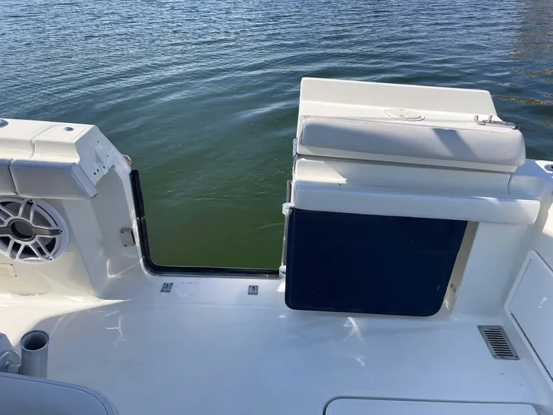 Slide: The Image of 2015 Hydra-Sports 3400 Center Console boat with open side door, on calm water. - 23