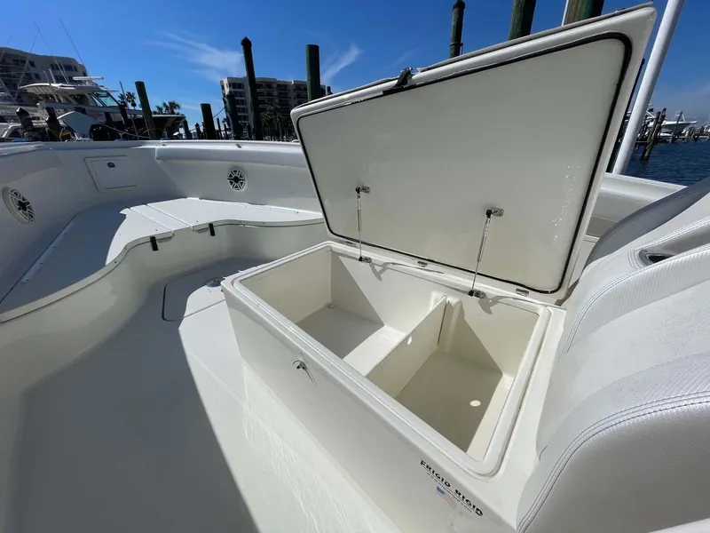 Slide: The Image of 2015 Hydra-Sports 3400 Center Console boat with open storage compartment on deck. - 25