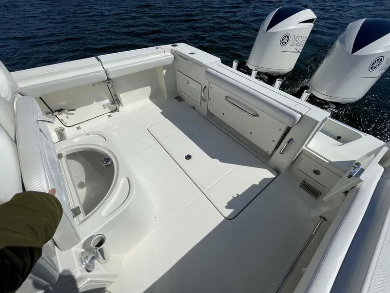 Slide: The Image of 2015 Hydra-Sports 3400 Center Console boat deck with twin outboard engines. - 26