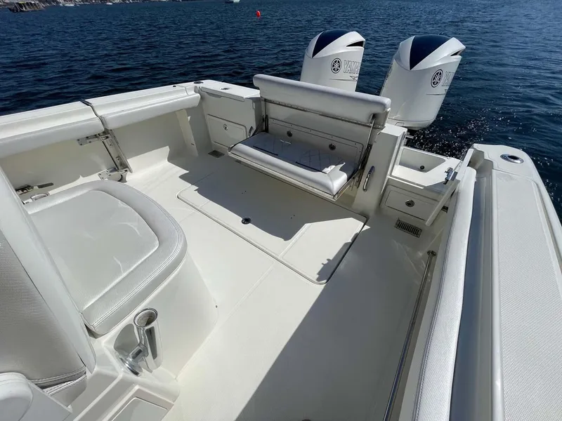 Slide: The Image of 2015 Hydra-Sports 3400 Center Console boat interior with dual engines on water. - 27