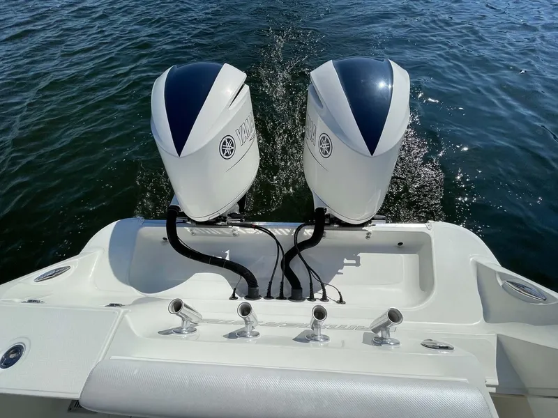 Slide: The Image of 2015 Hydra-Sports 3400 Center Console with dual outboard engines on water. - 30