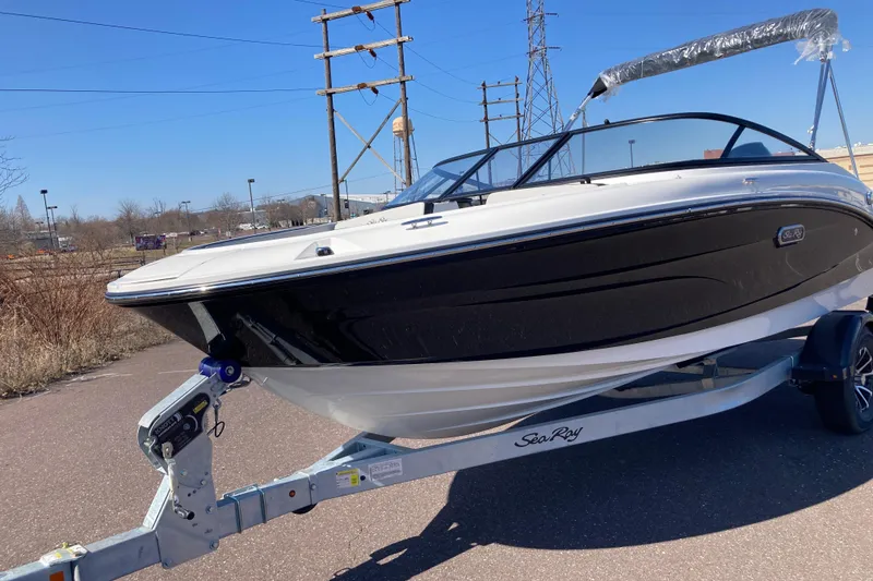 The Image of 2025 Sea Ray SPX 190 Outboard boat on trailer, parked outdoors. - 0