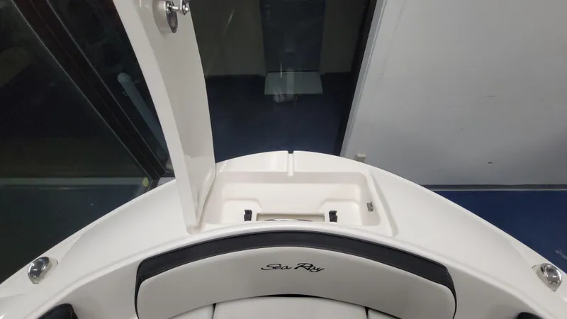 Slide: The Image of 2025 Sea Ray SPX 190 OB boat interior, featuring sleek white seating and modern design. - 10