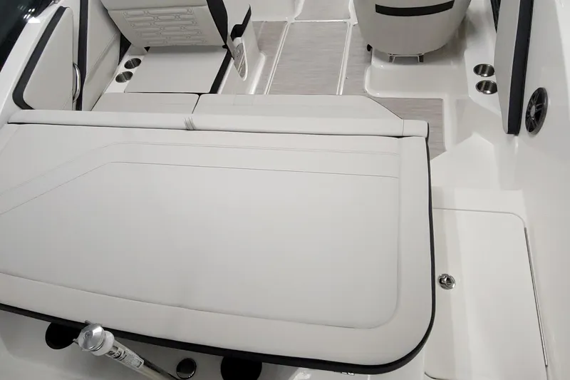 Slide: The Image of 2025 Sea Ray SPX 190 Outboard interior with white seating and cup holders. - 3