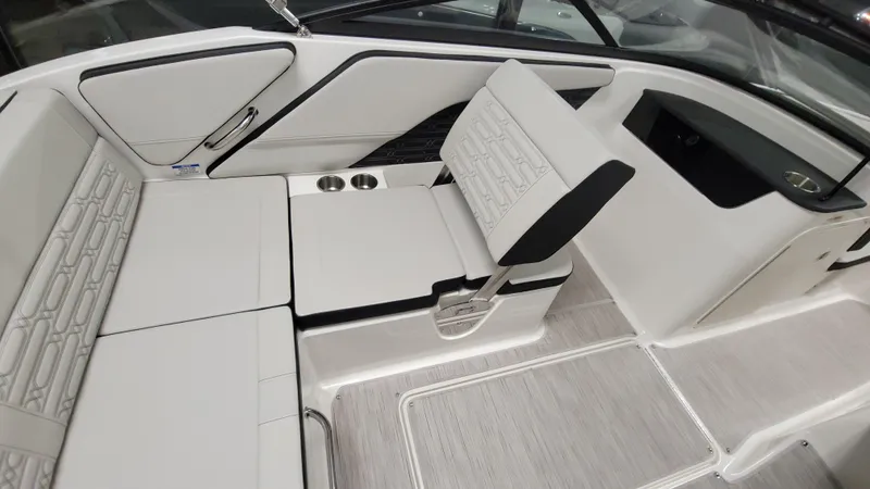 Slide: The Image of 2025 Sea Ray SPX 190 OB interior with white seating and modern design. - 4