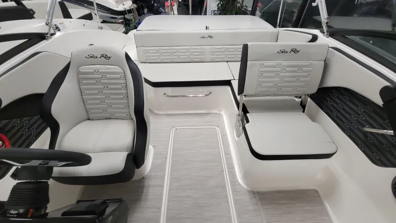 Slide: The Image of 2025 Sea Ray SPX 190 OB boat interior with sleek seating and modern design. - 5