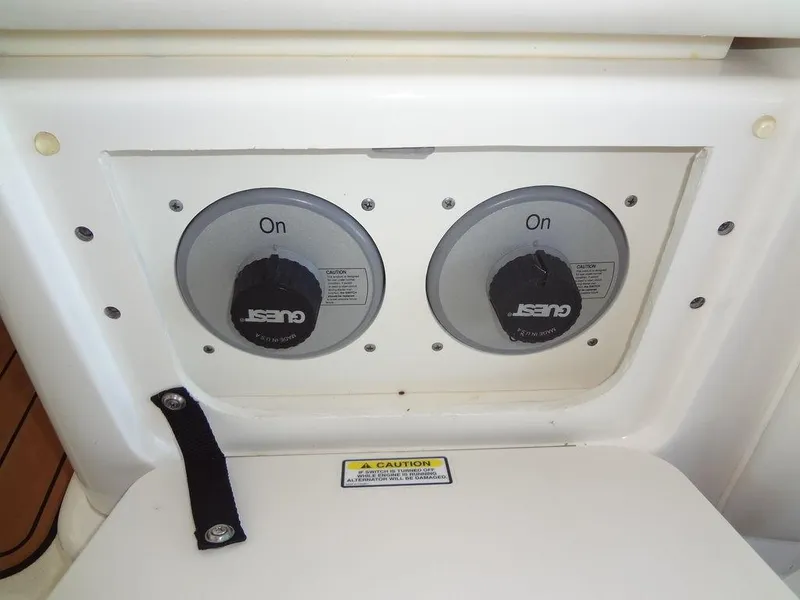 Slide: The Image of Dual battery switches on a 2005 Sea Ray 320 Sundancer boat. - 14