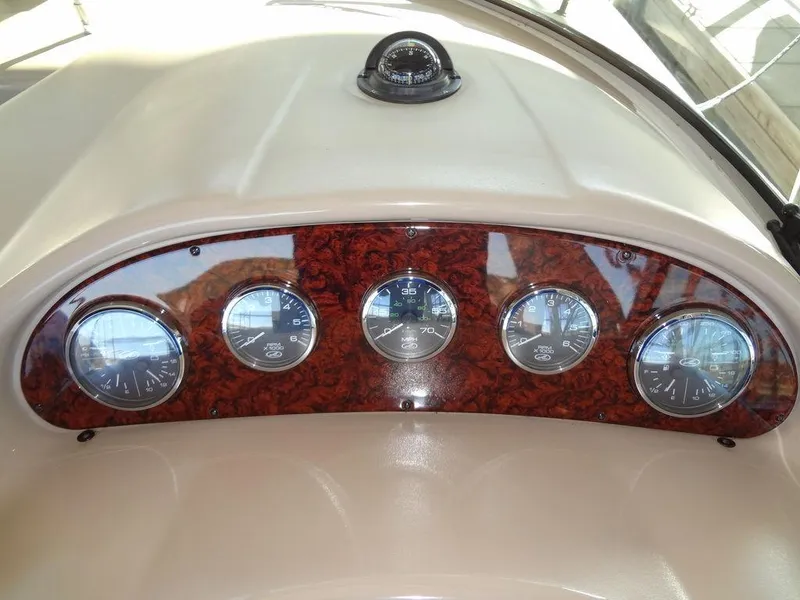 Slide: The Image of Dashboard of 2005 Sea Ray 320 Sundancer with gauges and compass. - 20