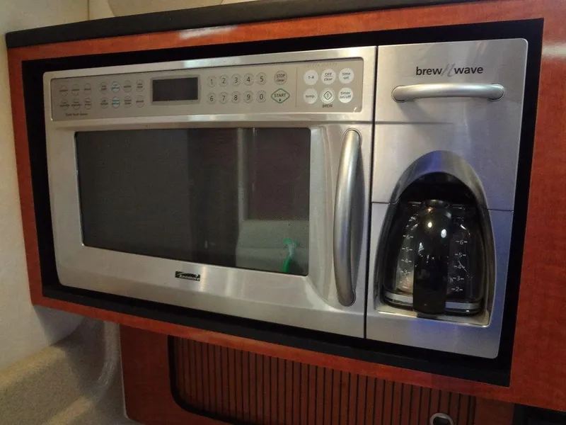Slide: The Image of Built-in microwave and coffee maker on 2005 Sea Ray 320 Sundancer yacht. - 31