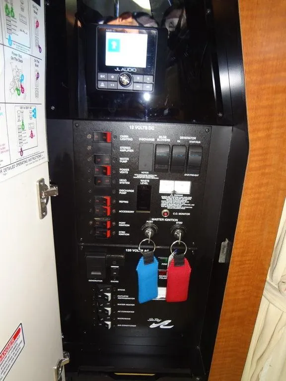 Slide: The Image of Electrical control panel of a 2005 Sea Ray 320 Sundancer boat. - 35