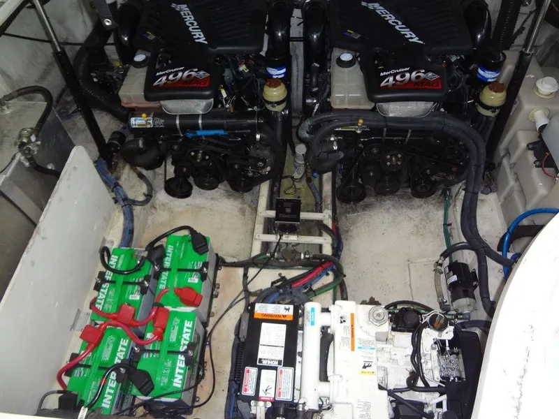 Slide: The Image of Engine room of 2005 Sea Ray 320 Sundancer with twin MerCruiser 496 engines and batteries. - 36