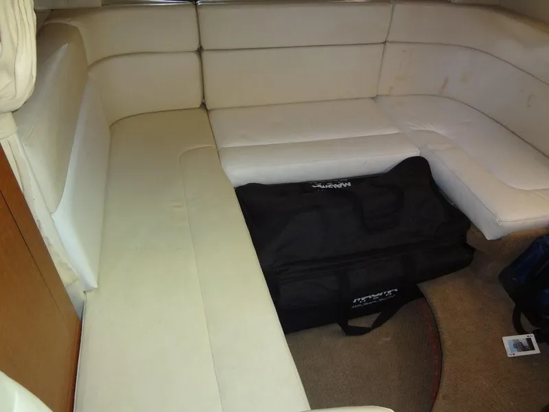 Slide: The Image of Interior seating area of 2005 Sea Ray 320 Sundancer with beige upholstery. - 37