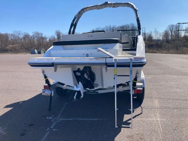 Slide: The Image of 2025 Sea Ray SPX 210 boat on trailer, rear view with ladder extended. - 5