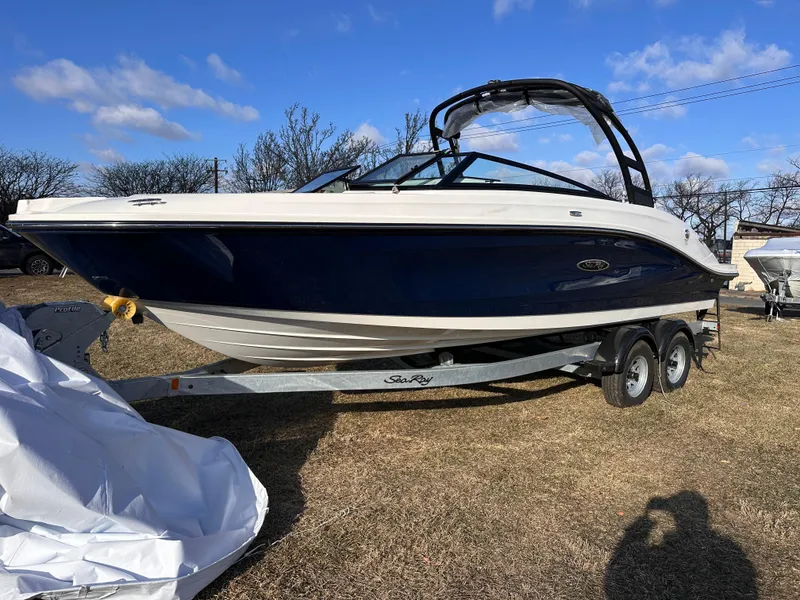 The Image of 2025 Sea Ray SPX 230 OB boat on trailer, parked outdoors. - 0