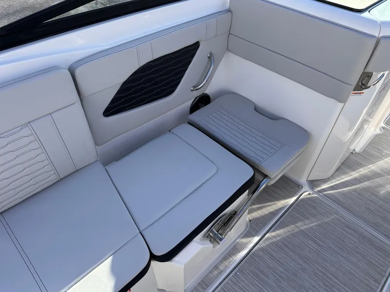 Slide: The Image of 2025 Sea Ray SPX 230 OB interior seating with modern design and comfortable upholstery. - 5
