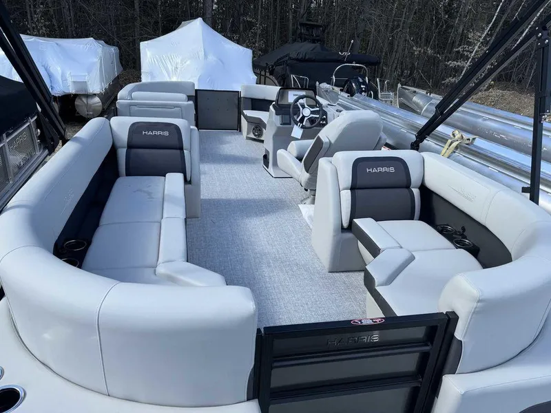 Slide: The Image of 2024 Harris Cruiser 210 boat interior with spacious seating and modern design. - 4