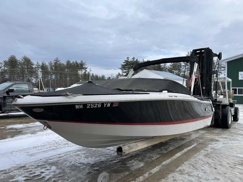 Slide: The Image of 2018 Four Winns Horizon 190 boat on forklift, covered, with snowy background. - 6