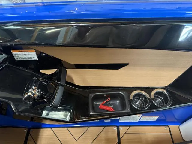 Slide: The Image of 2025 Yamaha Boats 222XD dashboard with steering wheel, cup holders, and safety lanyard. - 15