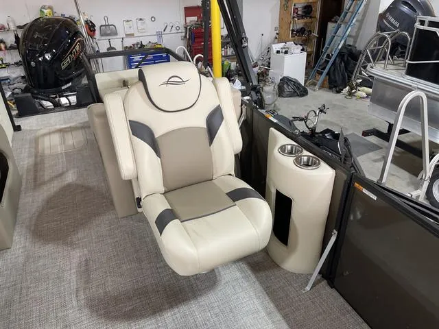 Slide: The Image of Luxurious seating on 2025 SunCatcher Select 322SS boat, featuring cup holders and modern design. - 11