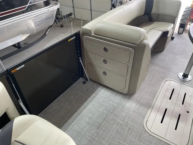 Slide: The Image of Interior of 2025 SunCatcher Select 322SS pontoon boat with seating and storage drawers. - 16