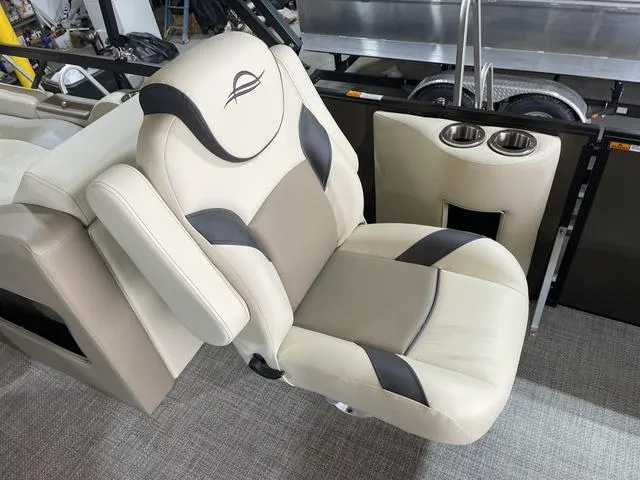 Slide: The Image of Luxurious seating in 2025 SunCatcher Select 322SS boat with cup holders. - 17