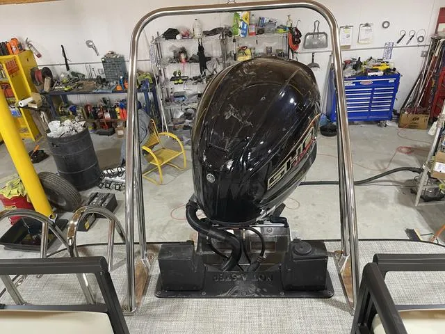 Slide: The Image of 2025 SunCatcher Select 322SS boat engine in a workshop setting. - 22