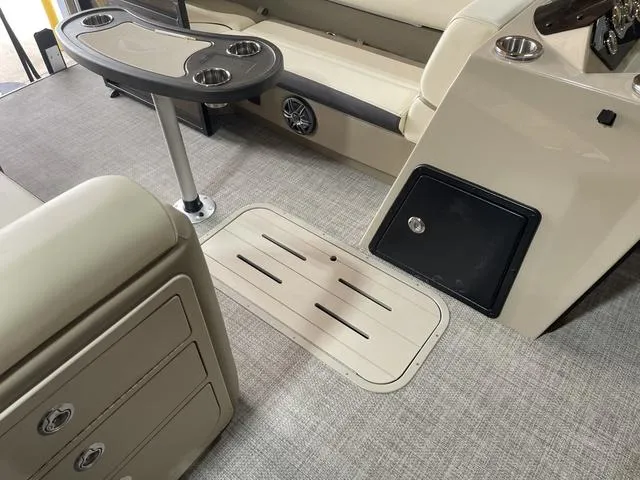 Slide: The Image of Interior of 2025 SunCatcher Select 322SS boat with seating and table. - 8