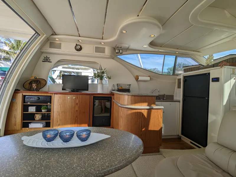 Slide: The Image of Interior of 1999 Maxum 4100 SCB yacht with modern amenities and elegant design. - 16