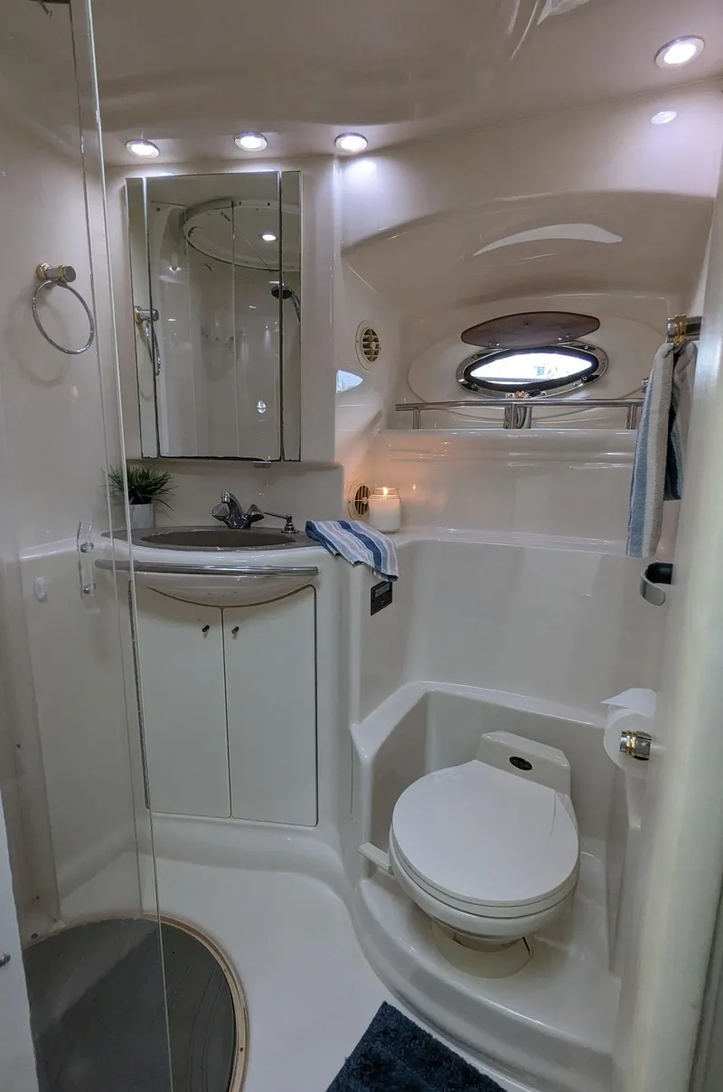 Slide: The Image of 1999 Maxum 4100 SCB yacht bathroom with modern fixtures and compact design. - 20