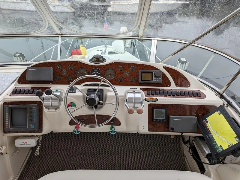 Slide: The Image of Cockpit of 1999 Maxum 4100 SCB yacht with navigation instruments and steering wheel. - 6