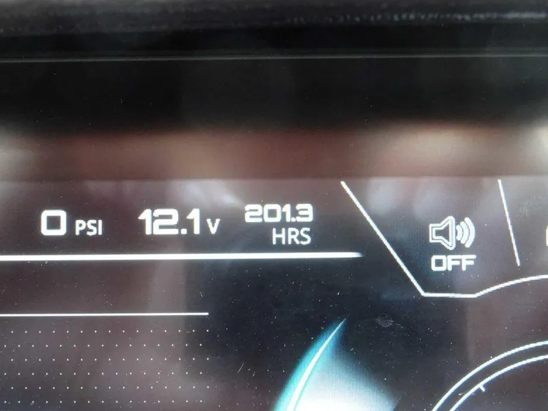 Slide: The Image of Dashboard display of 2021 Nautique G23 showing 0 PSI, 12.1V, 201.3 hours. - 18