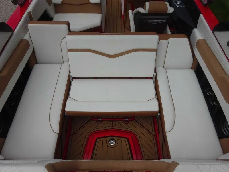 Slide: The Image of 2021 Nautique G23 boat interior with white and brown seating, featuring a stylish design. - 7