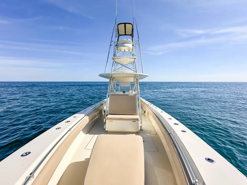 Slide: The Image of 2012 Contender 39 ST boat on open sea under clear blue sky. - 22